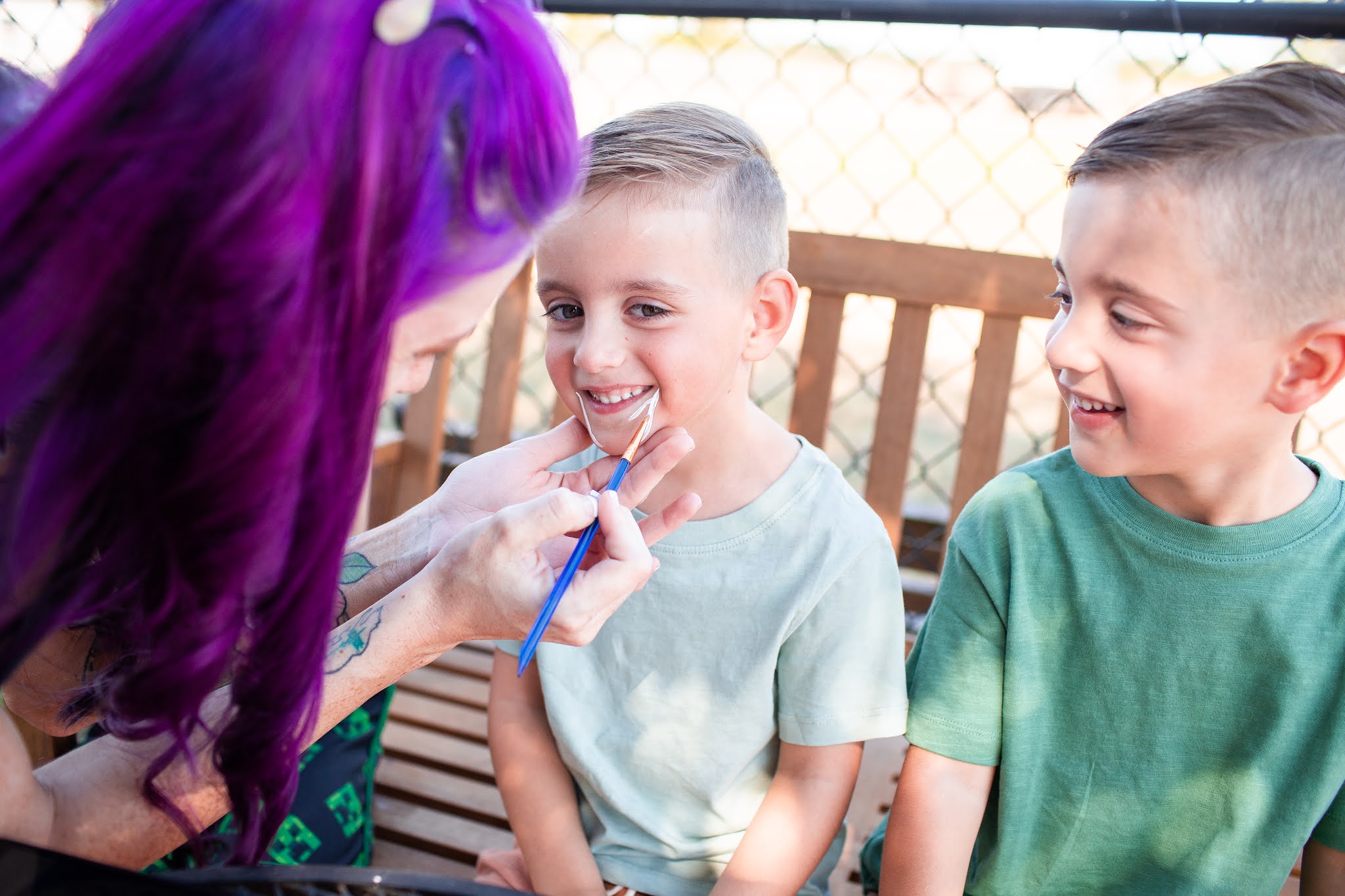 Modern state fair birthday party face painting for twin brothers