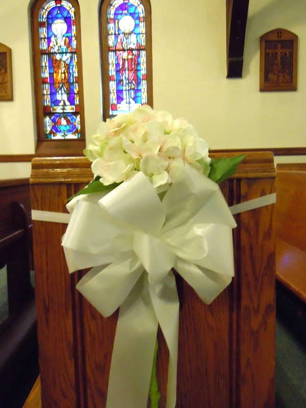 pew bows with white silk hydrangea wedding pew