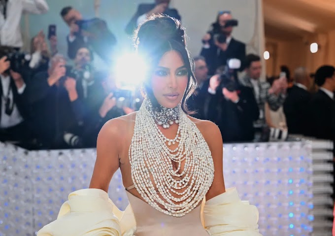 Kim Kardashian wants 'the lights off' in the bedroom, but has no inhibitions at a photoshoot: 'It's so weird'