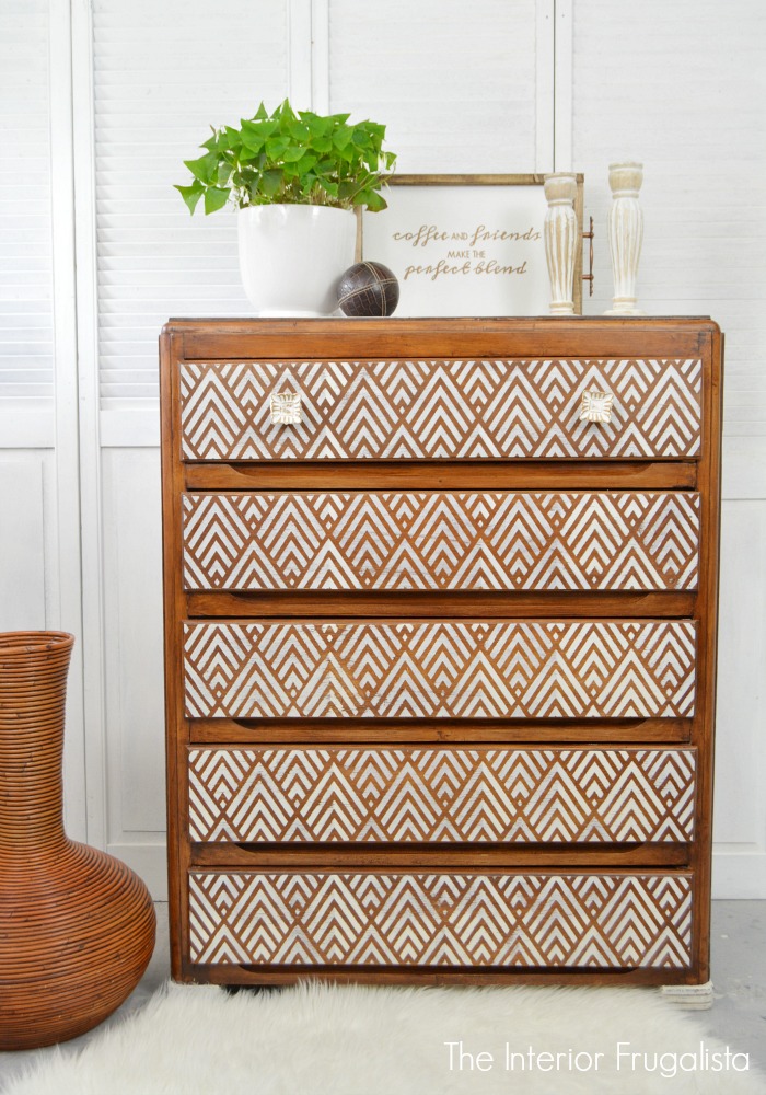 A pretty geometric stencilled dresser makeover with square white knobs from voyage to Hobby Lobby.