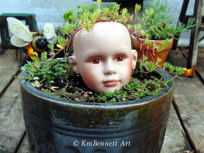 Blooming Hair broken doll head planter