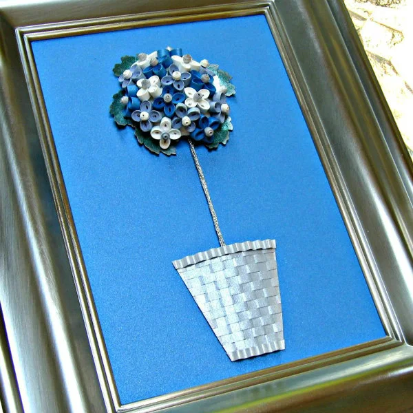 framed quilled topiary in woven paper basket