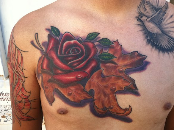Rose Leaves Tattoo / Peonies and leaves tattoo inked on the left forearm ... : The rose tattoo here shows the name of the beloved inked over the rose.