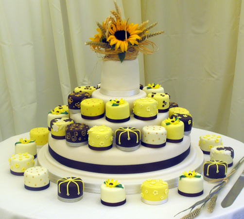 Bright and happy yellow white and black sunflower themed mini cakes