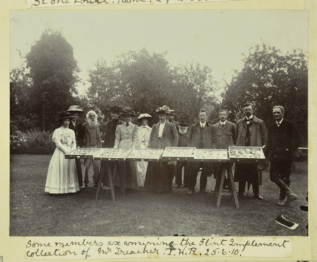 Caption: Some members examine the Flint Implement collection of Mr. Treacher.  [Llewellyn Treacher] T.R.W. 25.6.10 [1910]