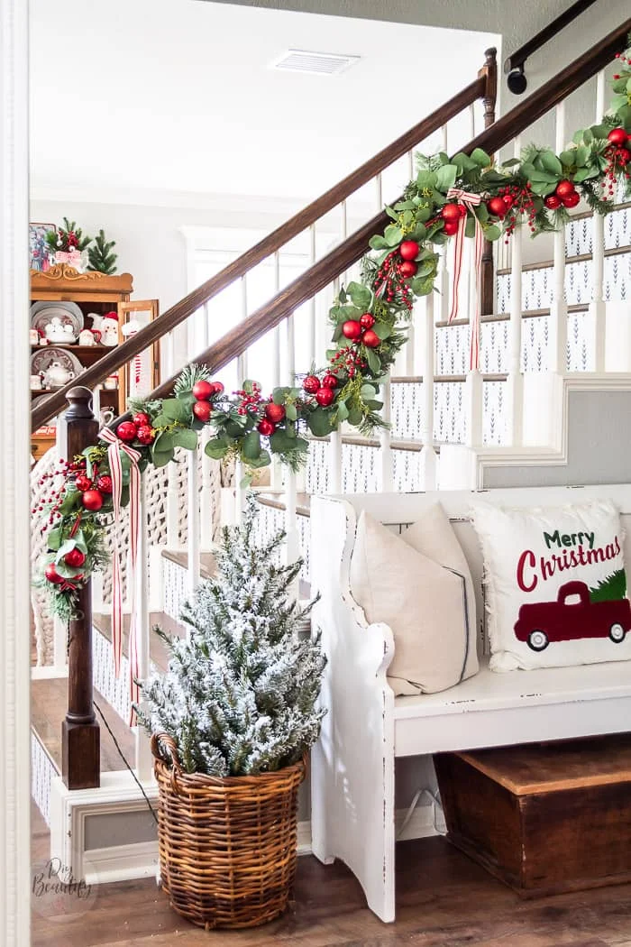 banister garland with ornaments and ribbon