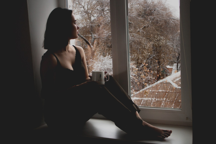 woman looking out of window