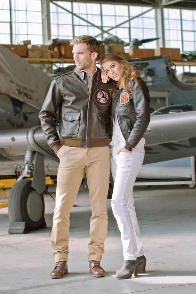 beautiful, young couple cosplaying top gun movie, wearing leather jackets