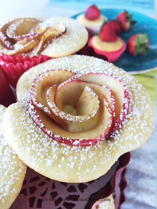 Apple rose cupcakes dusted with powdered sugar