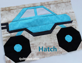 aqua hatchback truck with 2 pipes