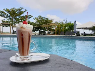 " Ice coffee by the pool at Houttuyn welness ressort Suriname"