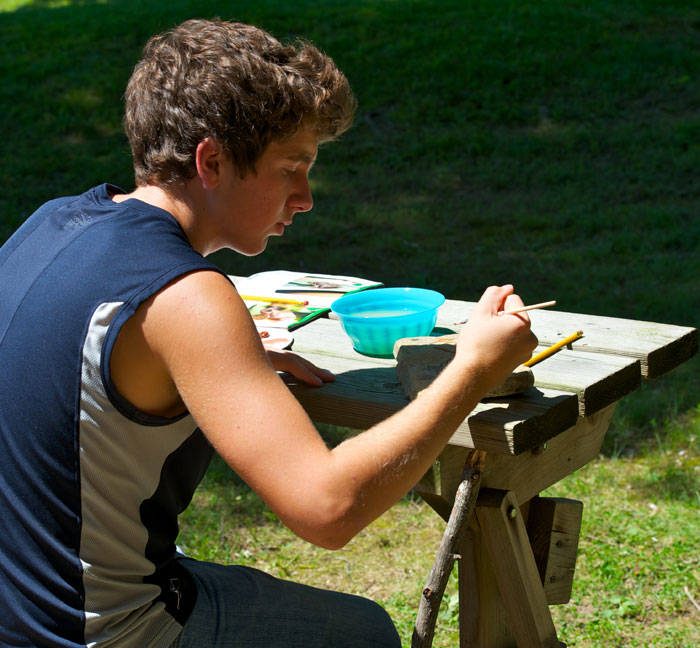 Matthew Riccetti painting after everyone is finished. Matty is a volunteer during the summer for Jenny Richards at the park.