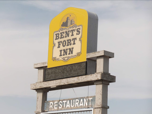 sign for the bent fort in and restaurant