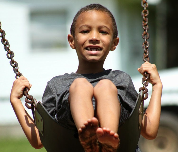 NAMC Montessori redirection vs distraction boy on swing with muddy feet