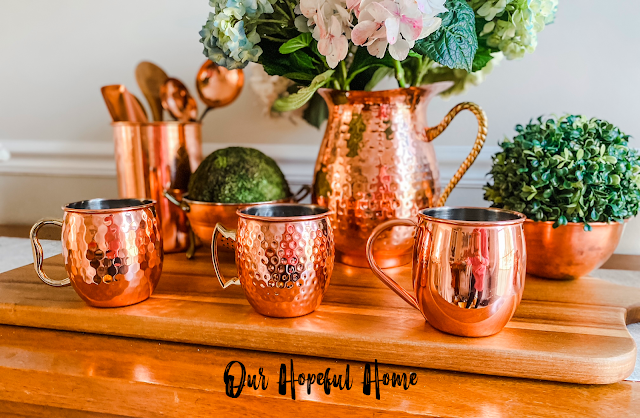 three copper Moscow mule mugs copper utensil holder copper ladles copper colander