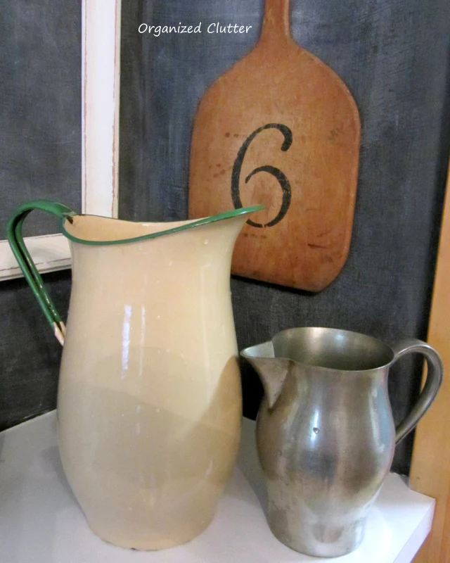 Old Pitchers in a Rustic Kitchen www.organizedclutterqueen.blogspot.com