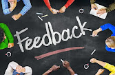 "Teacher reviewing assignments and providing feedback to students, highlighting the importance of constructive criticism in the learning process."