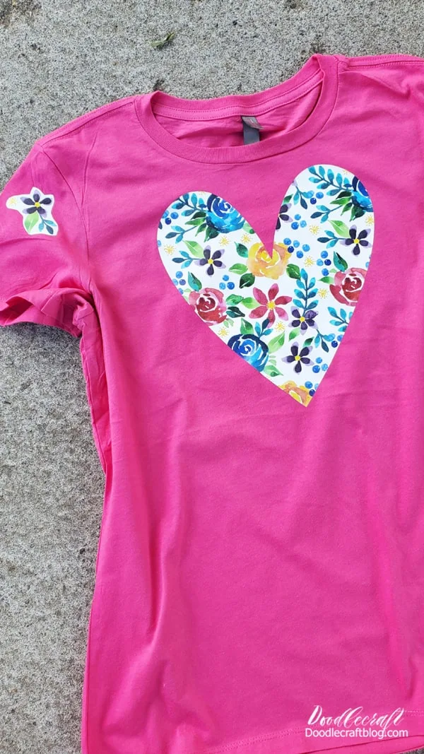 How to Make a Patterned HTV Shirt!  Learn how easy it is to make a patterned heat transfer vinyl design on a shirt!   The pattern of the vinyl takes the simple heart shape way up a notch!   I love this patterned vinyl with the large vibrant watercolor flowers--did you know I designed it!? 😉    If you haven't already heard, I designed 10 patterns for Expressions Vinyl and I've been posting about them all week.