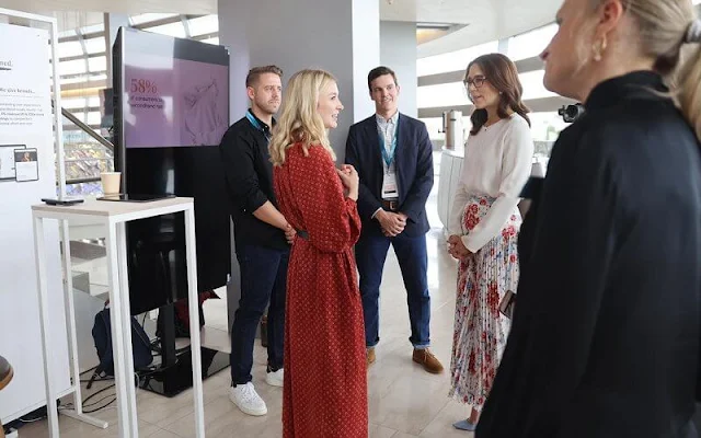 Crown Princess Mary wore a sunray pleated scarf print skirt by Paul and Joe, and white silk blouse by Elise Gug