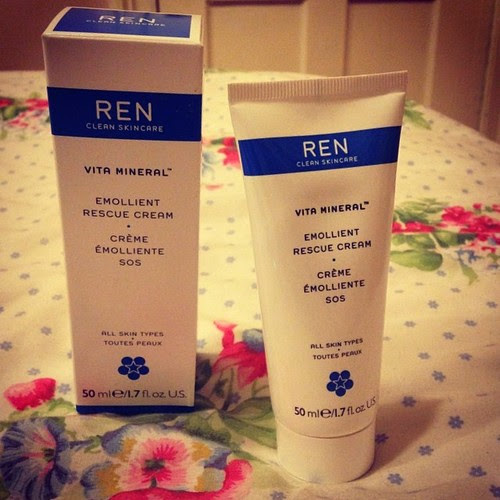 REN: Emollient Rescue Cream. Moisturiser for dry or sensitive skin against floral background