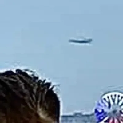 Close up of the silver UFO Disk over Blackpool tower UK August 2020.