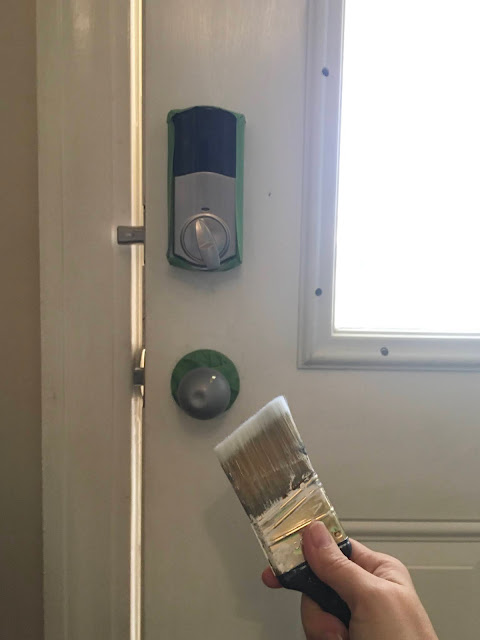 Update a boring entry way with a bright door and hand painted accent wall using a sponge! 