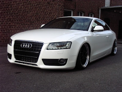 white audi a5 with with black rims and lowering springs