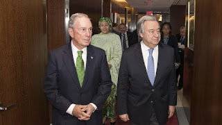 Mike Bloomberg with Antonio Guterres and UN deputy chief Amina Mohamed in the background (Picture Credit: UN Photo/Eskinder Debebe) Click to Enlarge.