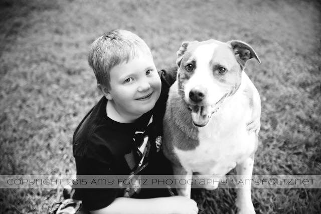 a boy and his dog at deming park in Terre Haute