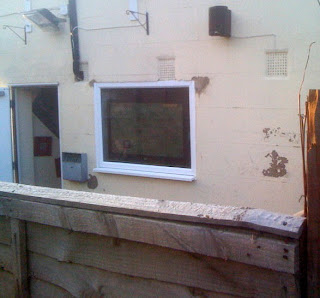 View of the match through the pub's back window!