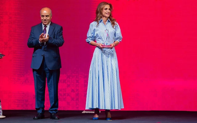 Queen Rania wore a blouson sleeve striped cotton shirt dress by Brandon Maxwel. Dior navy suede pumps