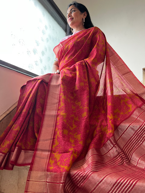 A Tapestry of Timeless Beauty: The Ochre and Pink Floral Pashmina Silk Saree with Zari Border
