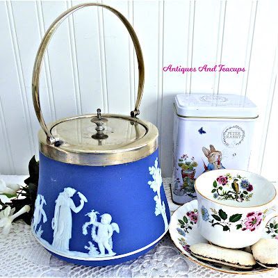 https://www.antiquesandteacups.com/products/edwardian-era-wedgwood-biscuit-barrel-dark-blue-jasper-dip-sacrifice-cookie-jar-silverplate?_pos=5&_sid=b8fb8a6f1&_ss=r