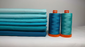 Kona solid aqua and turquoise fabrics with turquoise Aurifil thread