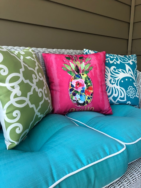 The Chic Technique: "Our Lilly Pulitzer-Inspired Porch." Summer outdoor decor with bright colors and floral accents. thechictechnique.com