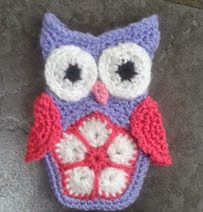 http://www.ravelry.com/patterns/library/betoto-the-little-african-flower-owl-phone-cover