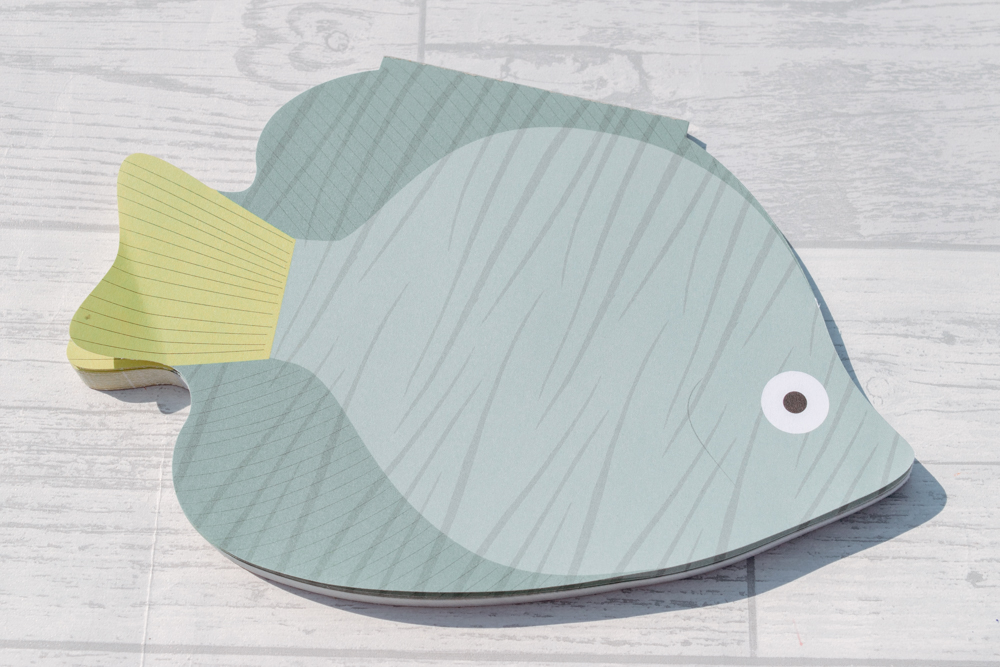 A fish shaped desk pad