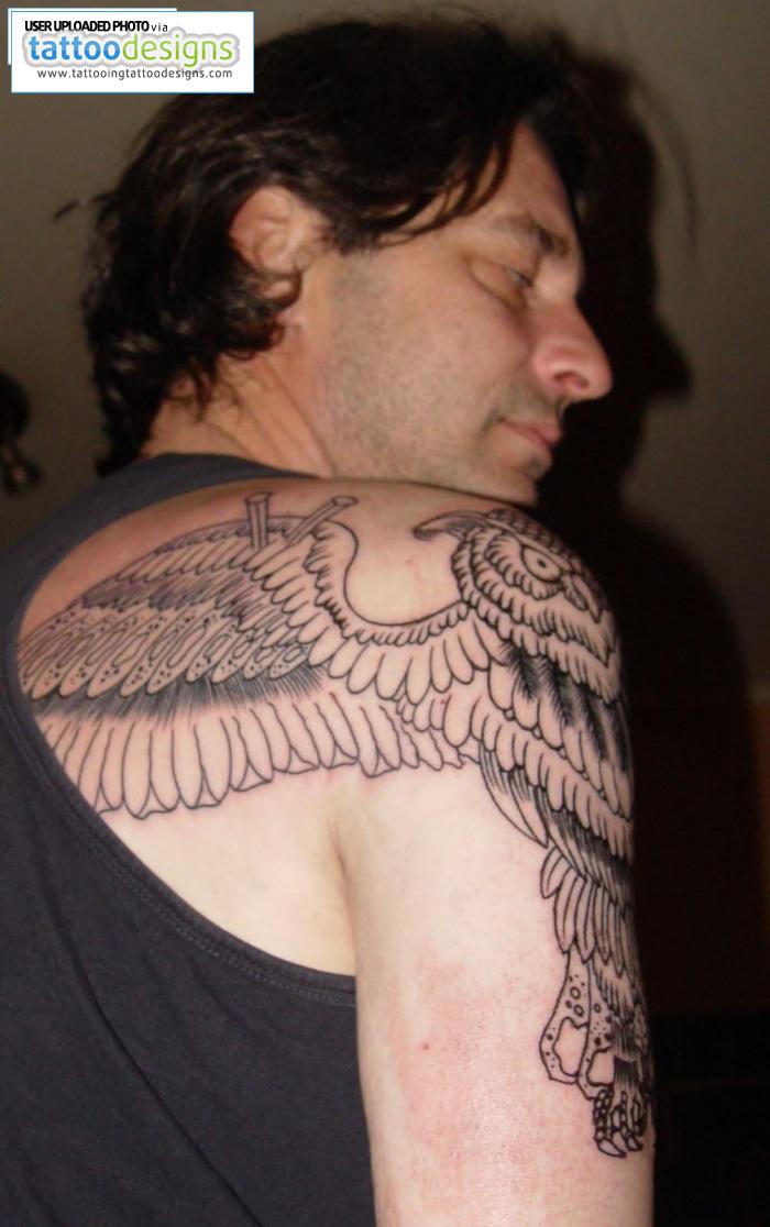 Guy Back Shoulder Tattoo