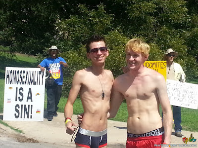 Austin PRIDE 2012 and Rhys Carter Studios Guys Dante Micuccio and Blake Barnett with anti-gay protesters