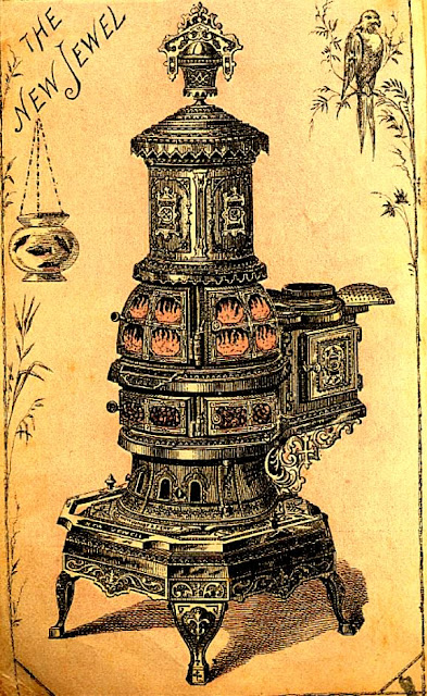 New Jewel stove with flames visible in upper portion. Much ornamentation. Probably coal-fired.