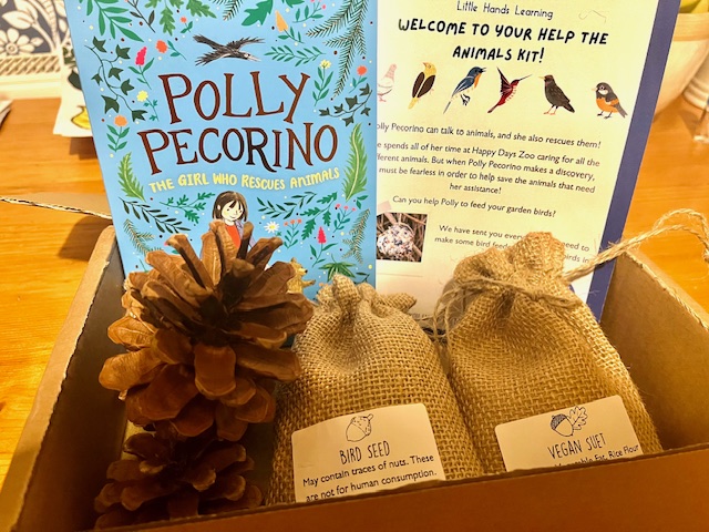 a box with a book and a pinecone