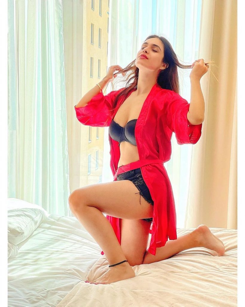 Actress Pics: Neha Malik Unique Styling Of Denim Shorts With A Satin Robe