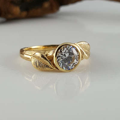 Hand sculpted leaves on a branch style band with a 1 ct Moissanite Diamond, solid 14k Yellow Gold Show