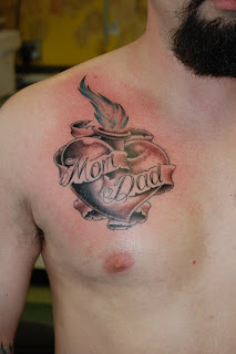 Heart Tattoos With Image A Male Tattoo With Heart Tattoo Designs On The Body Picture 8