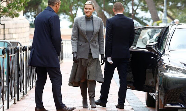 Prince Albert, Princess Charlene, Prince Jacques and Princess Gabriella. Charlene wore a grey jacket, sweater and skirt by Akris