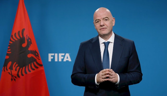 Gianni Infantino and the Albanian flag in the background
