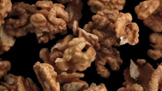top shot of walnuts spiraling towards camera
