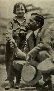 Will H. Hays, the President of the Motion Picture Producers and Distributors of America, and child actor Jackie Coogan, from page 64 of the October 1922 Photoplay. The caption states that Mr. Hays said, "I have a little boy just your age," to which Coogan said nothing.