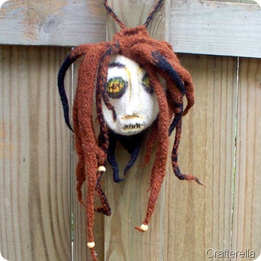 shrunken head bag embelished