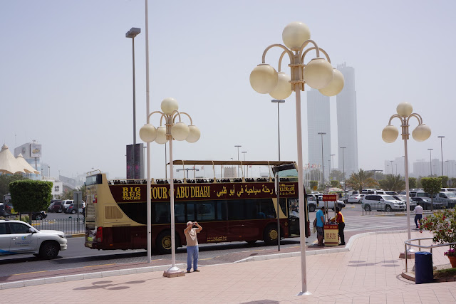 picture of the big bus tours stop in front of the marina mall in abu dhabi.